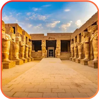 The entrance to an ancient temple with rows of statues leading to a doorway, representing historical or archaeological significance.